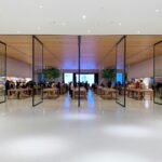 people standing near brown wooden tables