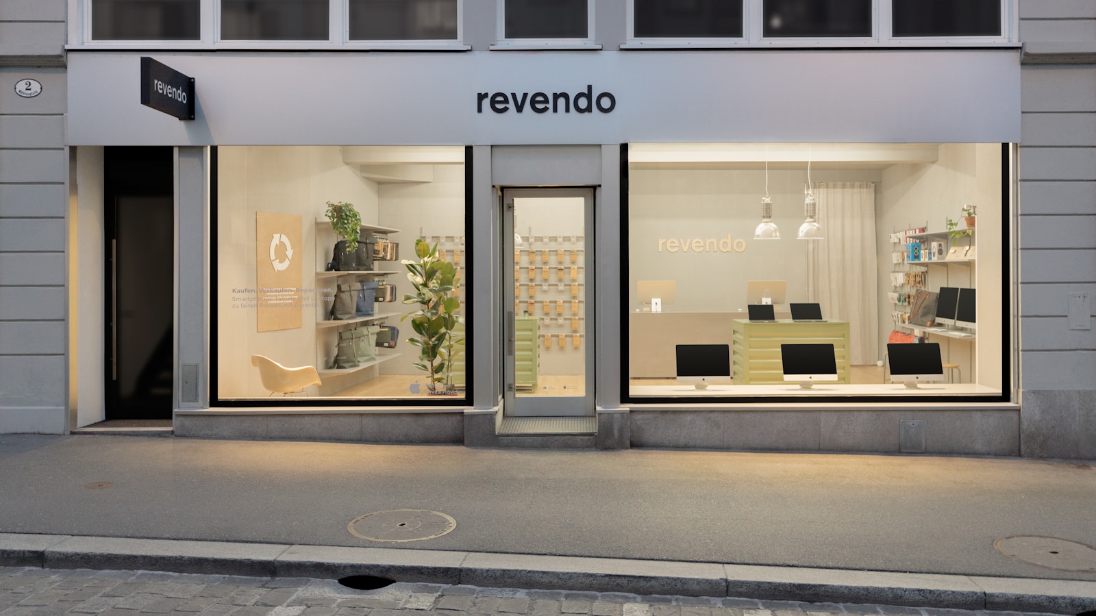 a store front with a lit up window